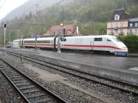 An ICE from Berlin arrives at a very wet Interlaken Ost on 12 October 2009. The track in the foreground is the narrow gauge line from Brienz/Luzern.<br><br>[Michael Gibb 12/10/2009]