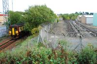 On the left a Sprinter passes through the site of the original Hawkhead station as it heads to Glasgow. To the right are the Hawkhead Oil sidings. These remained open after the Paisley Canal line closed to all other traffic west of Corkerhill shed and led to workings over the City of Glasgow Union line. The oil was Glasgow Airport aviation fuel as a pipeline runs from here to the airport. They now haven't been used for quite some time.<br><br>[Ewan Crawford 26/09/2009]