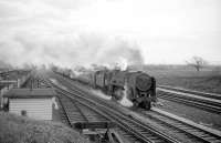 Britannia Pacific no 70008 <I>Black Prince</I> heads north out of Carlisle with a parcels train on the WCML around 1965 and has just passed Kingmoor shed in the left background.<br><br>[Robin Barbour Collection (Courtesy Bruce McCartney) //1965]