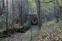 Looking at the northern portal of the Burdale Tunnel on 23 October 2009. This end of the tunnel is about a mile from Wharram station and a short distance from the abandoned medieval village of Wharram Percy. When the railway was authorised in 1846 it was planned to be a double track trunk route from the north-east to humberside. Construction did not start immediately but when it did the south end of the tunnel was one of the first work sites. Financial problems stopped construction and it was not until 1850 that it was restarted but it was now only to be single track line. The southern portal was already built for double track but the northern portal, 1774 yards away, when finished was only single track width. It is also interesting just how shallow the tunnel appears to be at the north end compared to the south. Refer to view from above the southern portal [see image 25911].<br><br>[John McIntyre 23/10/2009]