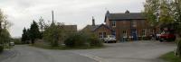 Snainton station on the former Forge Valley line between Pickering and Scarborough seen looking south across the station forecourt on 20 October 2009. This was the only station with two platforms on the line however traffic was always light and the line closed in June 1950. The station building is now a private residence. The car in Station Road on the left of the picture is parked where the level crossing had been.<br><br>[John McIntyre 20/10/2009]