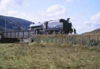 5025 replenishing its tender from the River Bran at Achnasheen on 25 September 1982. The locomotive was in the process of taking the 1125 ex-Inverness <I>Raven's Rock Express</I> special on to to Kyle of Lochalsh. <br>
<br><br>[Peter Todd 25/09/1982]