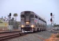 Pictured leading the northbound <I>Pacific Surfliner</I> train #579 into Oceanside Transit Center is AMTRAK cab car unit #6907. The train left San Diego at 13:25 and was scheduled to arrive in Los Angeles at 16:05.The day when the sun DIDN'T shine in Southern California is Friday, 21 August, 2009.<br>
<br><br>[Andy Carr 21/08/2009]