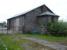 Former railway goods shed still in use alongside A5 trunk road to west of Corwen Station, with one loading door stoned up and full height roller shutter door fitted at far end.  <br><br>[David Pesterfield 07/05/2009]