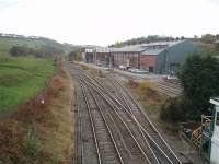 The view south from the overbridge by Great Rocks signalbox along the former Midland main line to London. Great Rocks Junction marks the start of the double track section towards Chinley but south from here the lines are, left to right, the Down and Up Goods (to Buxton and Hindlow), the Down and Up Tunstead siding and the entrance to Tunstead Works. The full semaphore on the left controls the access from the Buxton line to the double track section, while the shunting semaphores control the Tunstead exits.   <br><br>[Mark Bartlett 23/10/2009]