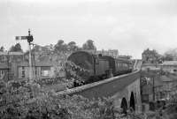 Some of us may remember a song by Adge Cutler : 'Pill, Pill, I love thee still'. Pill is a real place and also the local name for a tidal creek. Crossing this is a viaduct on the line from Bristol to Portishead. 82032 was hauling a train to Bristol in 1960. The branch lay dormant for many years, was later reopened as far as Portbury for freight and there is talk of passenger services once again.<br><br>[John Thorn //1960]