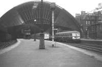 St Enoch on 26 June 1966. As the light begins to fade on the final day of scheduled passenger services, some of the last ever departures stand in the station.<br><br>[Colin Miller 26/06/1966]
