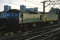 'Ethel 2' (Electric Train Heating Ex Locomotive No 2 ADB 97251) is propelled into Glasgow Central by 47 320 during the evening of March 3rd 1985. The Ethel units were former Class 25s that had been converted into mobile generators for heating Mk III coaching stock. They were used in situations where the train engine was unable to provide electrical heating (eg Class 37 hauled sleeper services over the West Highland line).<br><br>[Mark Dufton 03/03/1985]