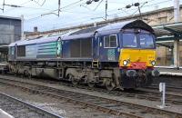 DRS 66413 waits in the middle road at Carlisle on 26 October with a southbound train of container flats.<br>
<br><br>[Bill Roberton 26/10/2009]