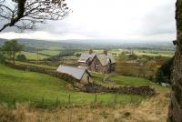 View west over the remains of Barras station towards the Lake District on 10 October, just as the rain started to fall. Opened by the South Durham & Lancashire Union Railway in 1861, this exposed part of the line, descending west from Stainmore Summit, became infamous due to the number of blockages in winter caused by major snowdrifts.<br>
<br><br>[John Furnevel 10/10/2009]