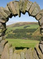 Framed by Andy Goldsworthy's sculpture <I>Touchstone North</I>, a Carlisle-Glasgow service threads though Drumlanrig Gorge near Ardoch farm.<br><br>[Andy Kirkham 11/09/2009]