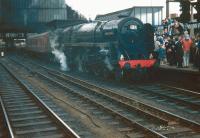 The BR <I>'Fifteen Guinea Special'</I> was billed as the final standard gauge main line passenger train to be hauled by a steam locomotive on British Rail. It ran on Sunday 11 August 1968, the day before the introduction of the main line steam ban. The photograph shows 70013 <I>Oliver Cromwell</I> (the last steam locomotive to be overhauled by BR) following its arrival at Carlisle with the special. <br>
<br><br>[Bruce McCartney 11/08/1968]