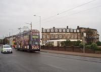 <I>Stop that tram!</I>  A Lancashire Constabulary patrol, leaving the nearby police station, overtakes Blackpool No. 707 outside Fleetwood's North Euston hotel. The hotel name betrays its LNWR origins and the building overlooks the ferry and tram terminals, close to the site of the long demolished railway station. This location, previously just for setting down, has become the Fleetwood Ferry raised tram stop for the new <I>flexity</I> tram services. [See image 40940]<br><br>[Mark Bartlett 06/10/2009]