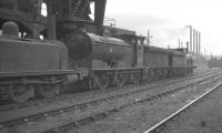 Locomotives at 65E Kipps shed, Coatbridge, in 1962 include J35 0-6-0 no 64472 (centre) with J36 0-6-0 no 65216 <I>Byng</I> standing beyond. Kipps was officially closed to steam in January 1963 following which it saw use as a diesel stabling point for several years before being finally demolished in 1975. <br>
<br><br>[Robin Barbour Collection (Courtesy Bruce McCartney) //1962]