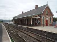 Newtown is a passing loop on the line from Shrewsbury to Aberystwyth and retains its substantial main building on the Up side, as seen in this picture looking towards Machynlleth in September 2009.<br><br>[Mark Bartlett 17/09/2009]