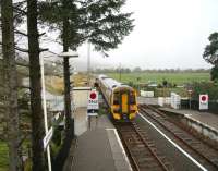 Bound for Kyle Lochalsh. A 158 pulls away from Strathcarron over the open level crossing on a wet 28 September, with the weather not looking much better further west.<br><br>[John Furnevel 28/09/2009]