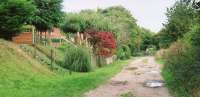 The trackbed of the DNS can be walked for some 1.5 miles South from these railway cottages, South of Burghclere station. We met two ladies of a certain age who had grown up in these cottages, before they had mains electricity, gas, or water. They couldn't remember the day or date when the last train passed through, but they remembered that it was a steam train, and that it passed their homes at 3.30 in the morning. Their mothers woke them to see the train, and the driver gave them sweets.<br><br>[Ken Strachan 13/09/2009]