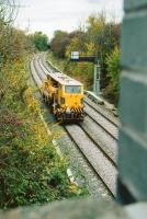 This location is just South of Chilvers Coton, South of Nuneaton. A track machine (apparently with at least one square wheel) heads North, past a footbridge recently replaced to allow 9 foot 6 inch containers to pass beneath on their way from Felixstowe.<br><br>[Ken Strachan 26/10/2009]