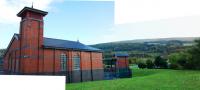 A building at Fairlie Pier, looking from the pier back towards the junction from the site of the platforms. Too new, but it reminds me of the old locomotive shed at Fairlie Pier, could they be related? [See image 26121.] (Note this is a stitch photo thus the blank top right and bottom left.)<br><br>[Ewan Crawford 18/10/2008]