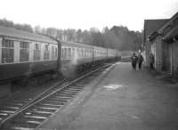 Brush Type 4 no 1536 takes the 8.50am St Pancras - Edinburgh Waverley away from Newcastleton on a chilly 28 December 1968 during the final days of operations over the line. [Editor's note: I came across this strangely evocative photograph in the RB file and did some digging! The 3 individuals on the platform, as well as the photographer, had all arrived separately at Newcastleton station that day to witness the passage of the train. Of note in the centre of the group is a cash-strapped student named McCartney.]<br><br>[Robin Barbour Collection (Courtesy Bruce McCartney) 28/12/1968]