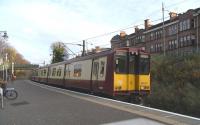 314 212 pulls into Maxwell Park with an Inner Circle working on 29 <br>
October.Class 314s, almost exclusive to the Cathcart lines, are at the bottom of the SPT electrics food chain and are sure to go in the cascade when 380s are introduced.They lack digitised announcements, in-train displays, toilets and even door buttons and the driver has to hand-crank the destination blind.<br><br>[David Panton 29/10/2009]