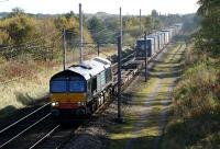 DRS 66413 is seen heading north from Standish towards Preston with the (4S44?) Daventry to Coatbridge container train on 16 October 2009.<br><br>[John McIntyre 16/10/2009]