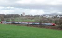 The University of Lancaster campus (and the hill known as Clougha Pike) form a backdrop to the Oubeck Loops as a Virgin Voyager takes a Birmingham New Street service towards Preston. <br><br>[Mark Bartlett 03/11/2009]