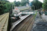 Looking west at New Mills Central. This station has no car park, no place to turn round, nor is there much provision for dropping off here. But it does feature an original building.<br><br>[Ewan Crawford 20/09/2007]