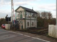 Just to the east of Rolleston station, on the Nottingham - Newark line, is Staythorpe level crossing which is controlled by this fine looking traditional signal box. The box also operates the associated semaphore signals for the crossing and block section and supervises the manually operated crossing at Rolleston station. It used to control access to coal and oil sidings for a nearby power station that have since closed.<br><br>[Mark Bartlett 23/10/2009]