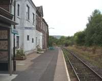 Builth Road High Level must once have been a bustling interchange station but all is peaceful now with only four Central Wales Line trains each way a day and 'request halt' status. The former station buildings are now private residences and this view looks south to the bridge over the Brecon line, where the lift to the Low Level station [See image 25482] was situated until that line closed in 1962. <br><br>[Mark Bartlett 17/09/2009]