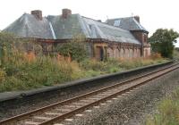 Closed to passengers in 1960, Brotton once handled trains on the Yorkshire coast line betweeen Teesside and Whitby. The old station and its adjoining yard are now used as a tyre and exhaust centre with the station house a private residence. The line has been singled and relaid on a new alignment through the old station and nowadays sees considerable freight traffic in the form of potash from Boulby and steel from Skinningrove.<br><br>[John Furnevel 13/10/2009]