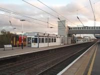 Dusk at Newark Northgate sees East Midlands Trains 153310 just arrived at the island platform of this rebuilt and modernised station. This view looks south along the East Coast Main Line.<br><br>[Mark Bartlett 24/10/2009]