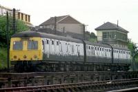 A Swindon Cross Country DMU drifts past Ferryhill signalbox on its way to Ferryhill MPD after a run from Inverness in 1974.<br><br>[John McIntyre /04/1974]