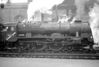 Royal Scot 4-6-0 no 46152 <I>The King's Dragoon Guardsman</I> at Carlisle on 23 January 1965 waiting to take forward the 9.25am Crewe - Perth train. This locomotive was originally 6100 <I>Royal Scot</I> but was involved in an identity swap with the newly built 6152 in order that the newer locomotive could be sent to the USA in 1933 to be exhibited as 6100.<br><br>[Robin Barbour Collection (Courtesy Bruce McCartney) 23/01/1965]