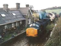 <I>Come on in, the water's lovely!</I>  37.141 hauling fresh ballast from Machen quarry goes for a paddle at Church Road on its way back to Park Junction in 1990. If I remember rightly, I was killing time before returning to work after a disastrous job interview.<br><br>[Ken Strachan //1990]