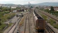 A loaded coal train enters East Usk Yard from the east. Coal for South Wales, not something I'd expected to see.<br><br>[Ewan Crawford 13/09/2006]