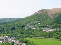 A valleys line train about to cross the river Taff just north of Taff's  Well in May 2004. Two other lines, the Cardiff Railway and the Barry Railway once shared this part of the valley.<br><br>[John Thorn 15/05/2004]