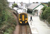 Two stops out from its final destination, the 1101 Inverness - Kyle of Lochalsh calls at Plockton on 29 September 2009. Those gathered under the canopy in the far corner of the platform are not passengers but students from the nearby Plockton High School on their lunch break. No, I've absolutely no idea...<br><br>[John Furnevel 29/10/2009]