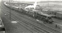 Kingmoor Black 5s nos 45364+44901  at the head of a car train which has recently arrived at Greenhill Lower Junction, circa late 50s/early 60s. The cars will be taken along the canal branch to the site of  the former CR Bonnybridge station (closed to passengers in 1930) which was at that time being used as a distribution centre for new motor cars arriving by rail. The canal branch was closed completely in 1964.<br><br>[Gordon Smith Collection (Courtesy Ken Browne) //]