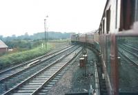 Having passed Carlisle no 3 box and crossed the River Caldew, a  Waverley route service for Edinburgh veers west away from the WCML at Port Carlisle Junction in December 1968. The train is crossing the goods lines on its way to Canal Junction, where it will eventually turn north. [See image 26254]<br><br>[Bruce McCartney /12/1968]