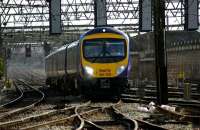 Trans Pennine Express double set from Manchester Airport on the final approach to Preston on 26 March 2009. The leading unit is bound for Edinburgh but the rear set will be split at Preston and follow the Edinburgh portion up the WCML as far as Oxenholme where it will branch off to Windermere. To the right of the train is the girder bridge over the River Ribble. This was added to the earlier stone arch bridge which itself was extended to serve the 5 tracks that are in regular use today.<br><br>[John McIntyre 26/03/2009]