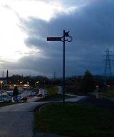 Looking West towards the site of North Johnstone as the sun begins to set. The replica signal carries the words 'Railway Path', and is part of the new signage being erected by SUSTRANS on former railway trackbeds now used as cycle paths.<br><br>[Graham Morgan 15/11/2009]