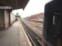 A Sprinter pauses at Wakefield Kirkgate before reversing for Wakefield Westgate. This view looks east and towards Normanton (straight on) The lines for Doncaster or Pontefract (right) run behind the opposite platform.<br><br>[Mark Bartlett 04/09/2009]