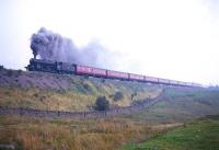 Stanier Black 5 no 45041 at the head of a 10 coach train near Shap Wells in the mid 1960s.<br><br>[Robin Barbour Collection (Courtesy Bruce McCartney) //]