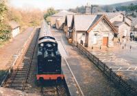 Hawes is a nice town, the station buildings are wonderfully preserved, the MR fencing is just right - but the tracks only extend as far as the ends of the platforms, and that nice steam train is stuffed and mounted. Let's hope the Wensleydale Railway get services back here. View looks East from the road bridge.<br><br>[Ken Strachan 09/05/2009]