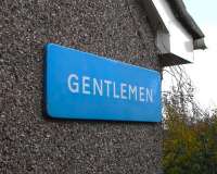 This Scottish Region 'Gentlemen' sign is placed on a gable of my house <I>pour epater les voisins</I>. It is an odd one because the colour is not quite right: heading towards powder blue compared with the usual, stronger Caledonian blue.  It also doesn't use the mandatory Gill Sans lettering: the G is all wrong though the other letters are superficially similar to Gill Sans.  I can only assume it was not made by the usual manufacturer and that they were given (or took) a little licence.  Unlike abberant postage stamps this doesn't seem to make it much more valuable - either that or I got a real bargain!<br><br>[David Panton 15/11/2009]