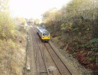 Taken from the road bridge over the eastern portal of Blackburn Tunnel this picture shows Pacer 142002, cautiously approaching the tunnel, and also the signals protecting Daisyfield Junction where the Clitheroe and Hellifield line branches away from the Accrington line. <br><br>[Mark Bartlett 17/11/2009]