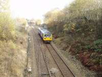 Taken from the road bridge over the eastern portal of Blackburn Tunnel this picture shows Pacer 142002, cautiously approaching the tunnel, and also the signals protecting Daisyfield Junction where the Clitheroe and Hellifield line branches away from the Accrington line. <br><br>[Mark Bartlett 17/11/2009]