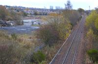 Looking east towards Dunfermline from Cairneyhill on 16 November. To the left is the former goods yard, recently vacated by a construction company and now awaiting commuters for the reopened station.....� in a few years perhaps?� Following the reopening of the Stirling - Alloa - Kincardine link and the rerouting of the Longannet coal trains this section currently sees very little traffic.<br><br>[Bill Roberton 16/11/2009]
