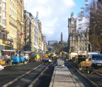 An Autumn sun illuminates Princes Street on 17 November 2009 as the approach of Christmas becomes ever more apparent. Edinburgh's Christmas tree has just been winched into place on The Mound, various rides and amusements are springing up in Princes Street Gardens, Christmas toys and gifts predominate in the shops, children are thinking about Santa Claus ...and the good people of Edinburgh are starting to believe in trams.     <br><br>[F Furnevel 17/11/2009]